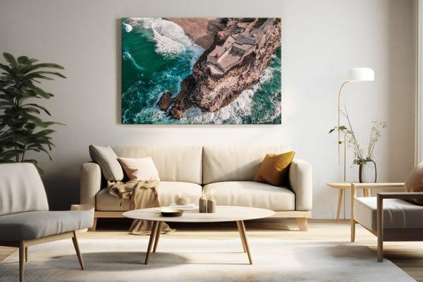 Nazare coastal print in modern living room, above beige sofa, with neutral decor.